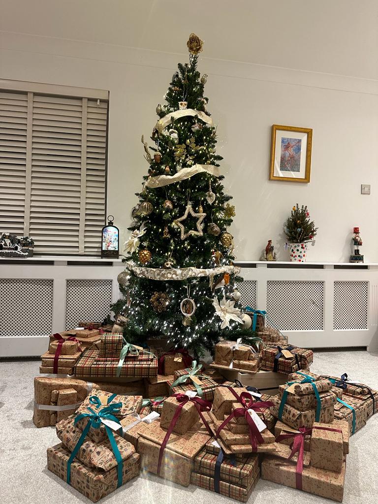 A Christmas tree surrounded by more than a hundred wrapped presents for Vorto&rsquo;s Toy Project